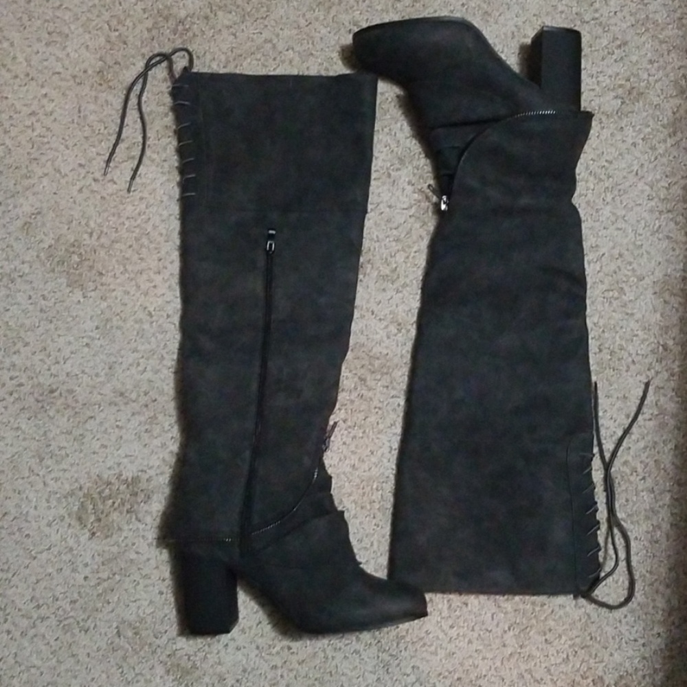 Knee high boots with laces.   NWOT